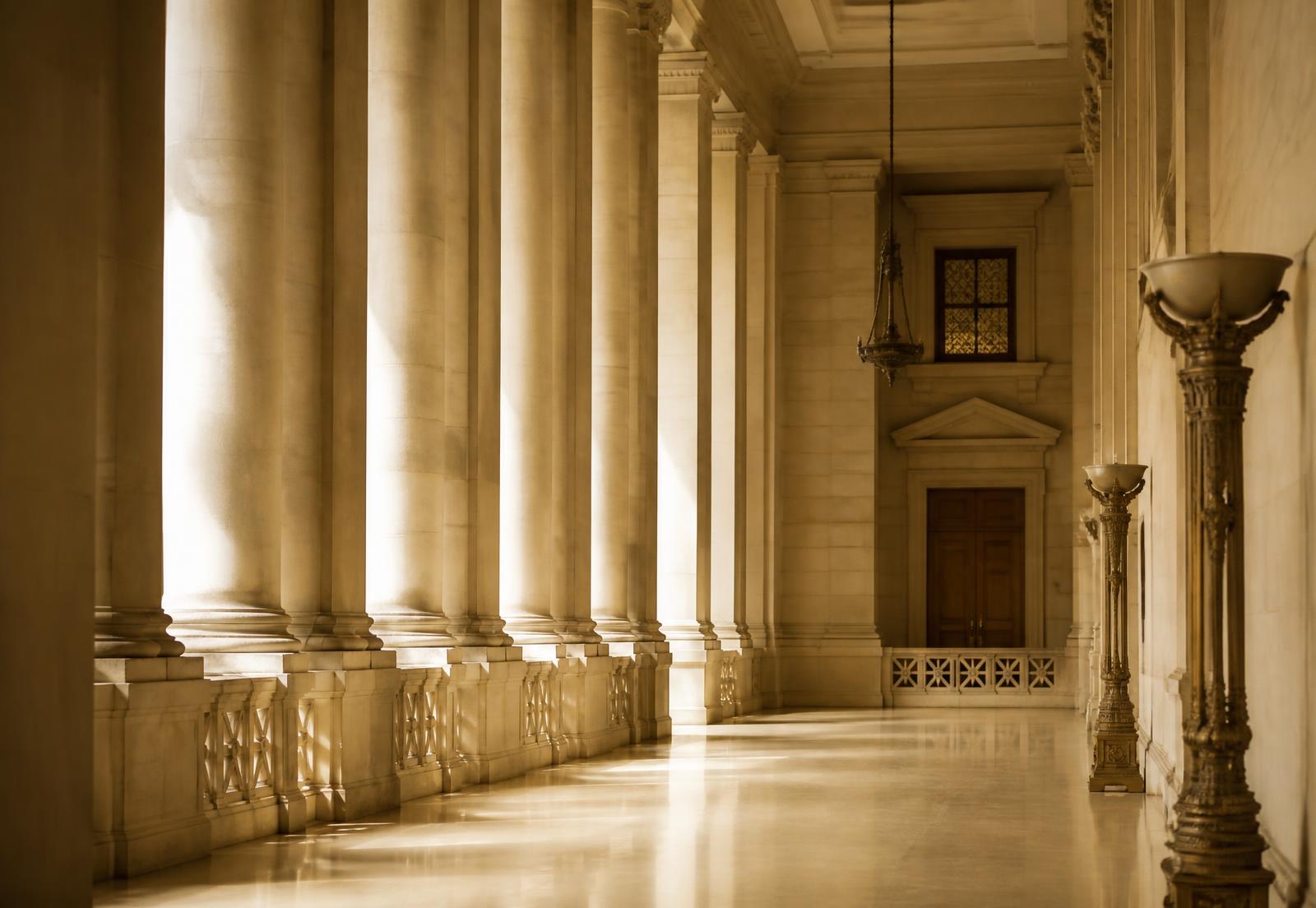 Sunlit colonnade of an institutional hall